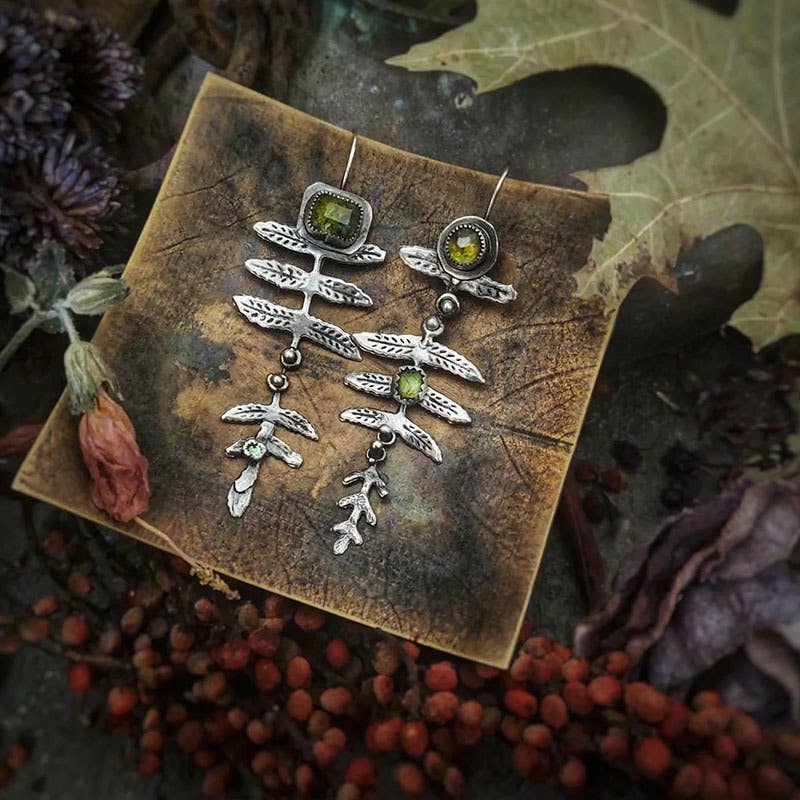 Vintage metal leaf inlaid olive green rhinestone earrings: Silver