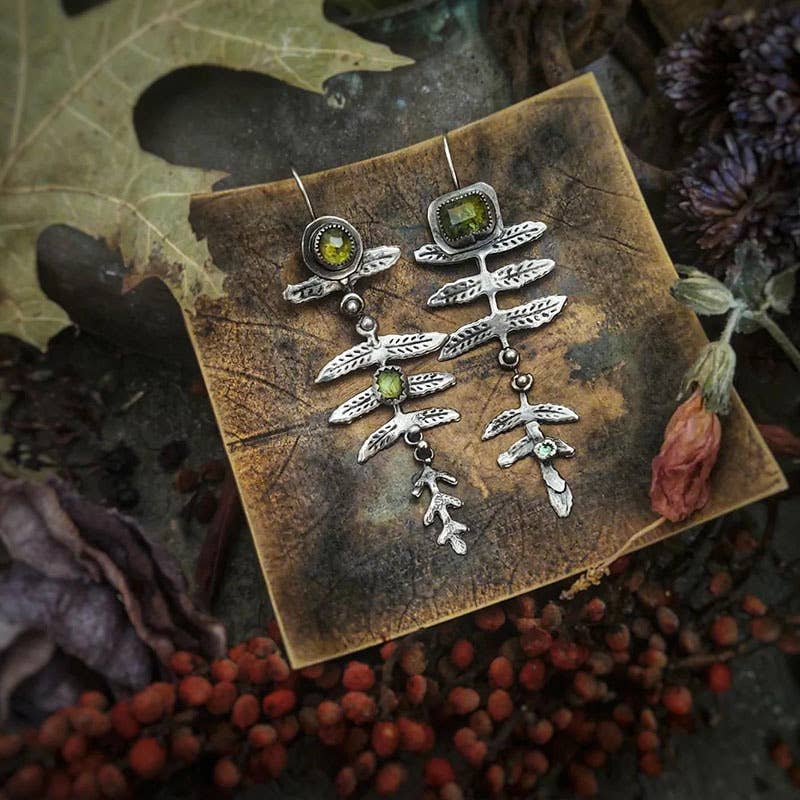Vintage metal leaf inlaid olive green rhinestone earrings: Silver