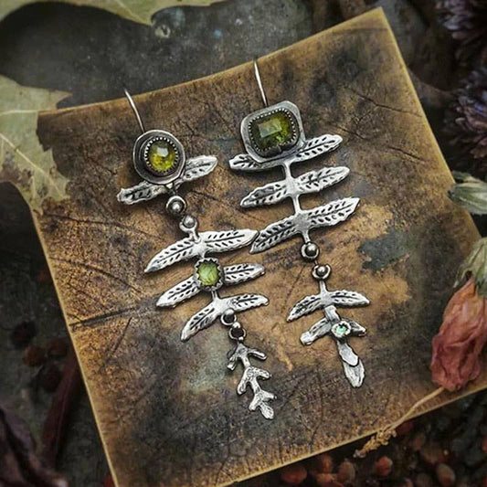 Vintage metal leaf inlaid olive green rhinestone earrings: Silver