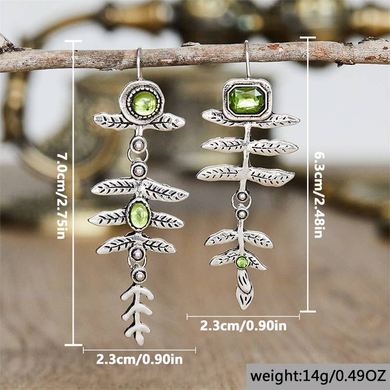 Vintage metal leaf inlaid olive green rhinestone earrings: Silver